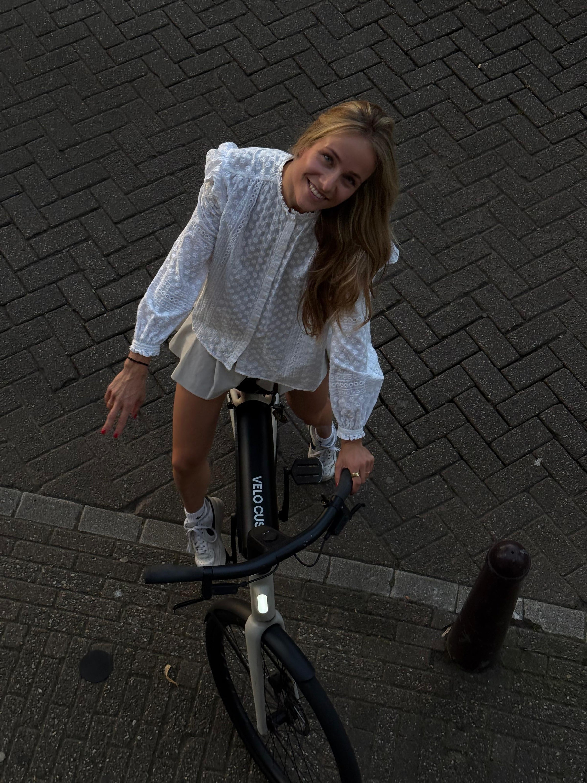 Nina riding an e-bike for the VELO CUSH founder story